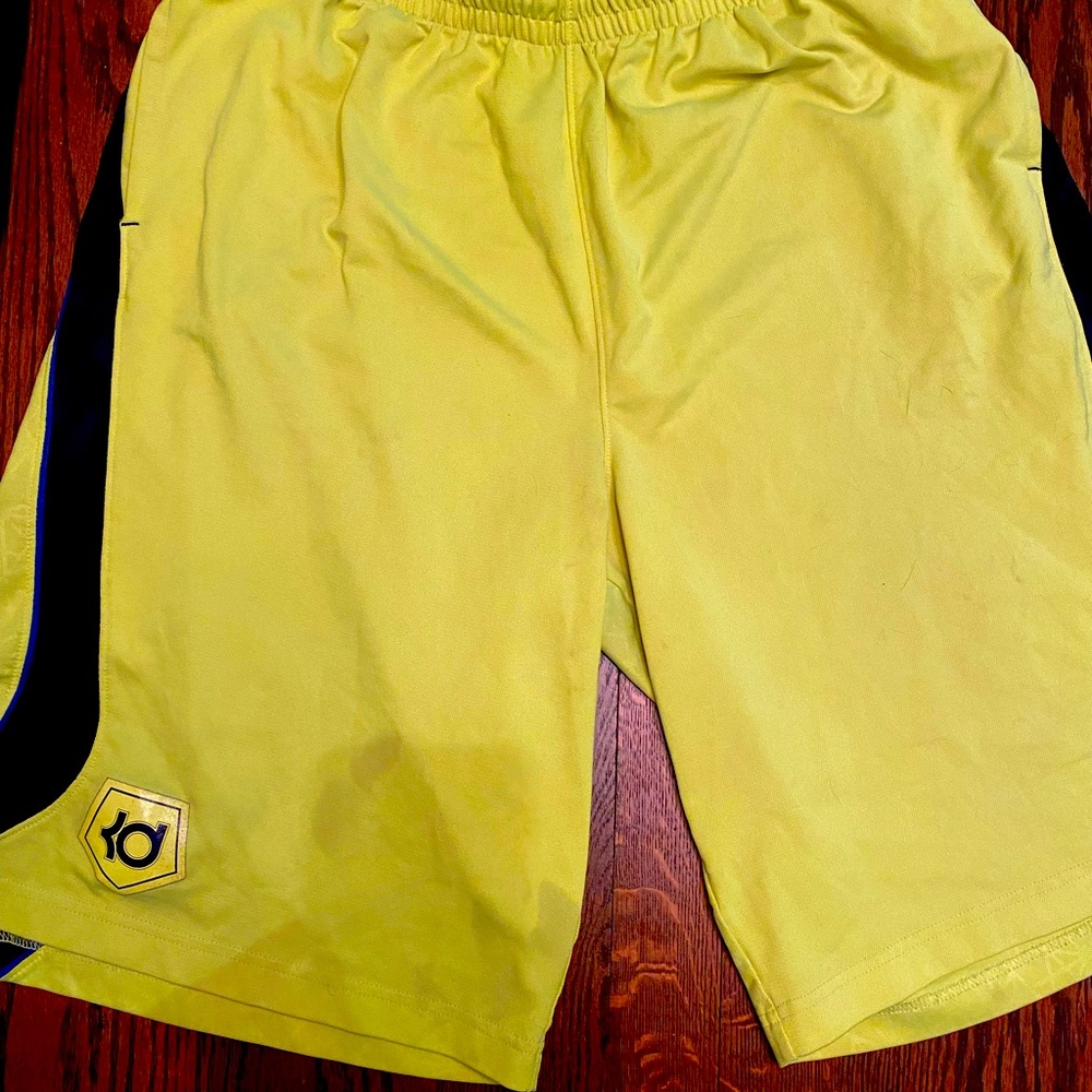KD basketball shorts, neon green with blue stripes
